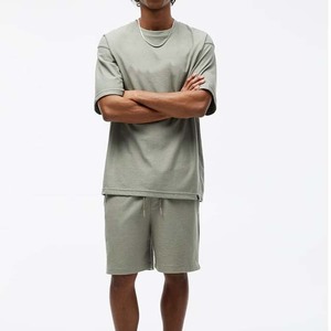 เสื้อยืดคอกลมแขนสั้นสำหรับผู้ชายสูทลำลองผ้าคอตตอนสีพื้นสำหรับใส่เล่นกีฬาฤดูร้อน - Product Image 1
