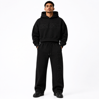 Ensemble survêtement streetwear haut de gamme en coton noir imprimé, comprenant un sweat à capuche oversize épais et un pantalon de survêtement large, personnalisable avec logo OEM