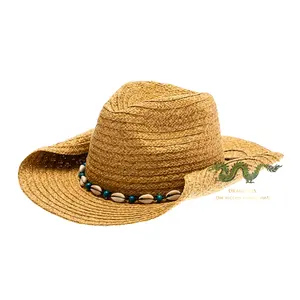 Sombrero de vaquero de paja unisex adornado con una cadena de conchas marinas y cuentas azules Una elegante fusión de tradición y elegancia