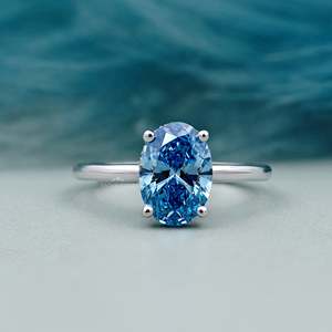 Anillo de compromiso ovalado con halo oculto y diamante azul de fantasía certificado por IGI - Product Image 1
