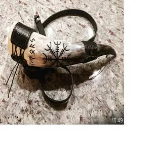 custom made hand carved drinking horns with leather strap holders along with custom engraving ideal for resale by viking supply