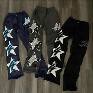 กางเกงวอร์มผ้าฟลีซสำหรับผู้ชายโอเวอร์ไซส์ผ้าฟลีซสำหรับผ้าพัฟพิมพ์ลายผ้าฝ้าย - Product Image 1