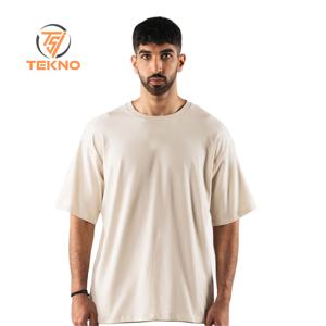 เสื้อยืดผ้าฝ้าย100% น้ำหนักเบาใส่ได้ทั้งชายและหญิงเสื้อโอเวอร์ไซส์สำหรับผู้ชายเสื้อผ้าแนวสตรีทพิมพ์ลายโลโก้ยาว - Product Image 1