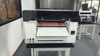 Impresora de cama plana UV de producción de fábrica A3 XP600 cabezal DX7 cabezal de impresión 4050 Mini máquina de etiquetas automática buen precio para nuevas condiciones