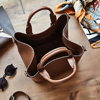 Nouveautés 2025 – Sac seau de luxe en cuir véritable avec fermeture éclair géométrique et chaînes, style bohème minimaliste pour femme, avec bandoulière