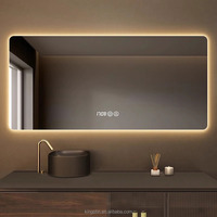 Kingtin Espejo Baño LED Inteligente | Espejo de Tocador Retroiluminado Sin Marco con Antivaho, 3 Colores, Hora