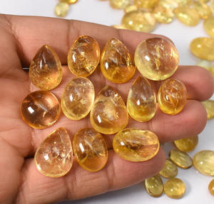 พลอยซิทรินธรรมชาติ คละขนาดและรูปทรง แบบคาโบชอง ขายส่ง ล็อต 635 กะรัต 87 ชิ้น - Product Image 5