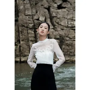 El mejor precio Blusas y camisas de mujer Wit Flower Accesorio MALLA PUFF MANGA BLUSA Cupro Poliéster WHITEANT Manufacturing Company - Product Image 1