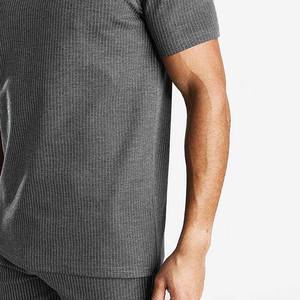 Conjunto corto de ropa de verano de secado rápido para hombres y con logotipo personalizado Patrón sólido 100% Chándales de algodón - Product Image 5