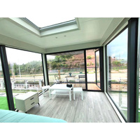 Capsule spatiale modulaire de luxe préfabriquée intelligente, conteneur de glamping, villa/appartement moderne à structure rectangulaire en acier, étanche et économique