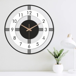 Stylish Black And White Metal Wall Clock With Modern Round Design Perfect Decorative Timepiece For Home Office And Living Room - Product Image 4