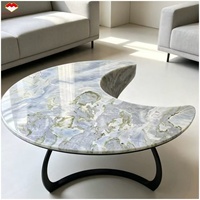 Table à manger élégante en marbre bleu Maldives avec plateau tournant, table basse en marbre bleu lac et comptoir d'îlot design banquette