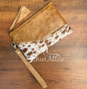 Venta al por mayor de moda de lujo de diseñador de cuero de vaca bolso de mano para las mujeres de alta calidad de cuero genuino cartera borla cremallera bolsa - Product Image 1