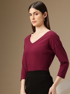 Top de mujer con cuello en V de alta calidad con adornos de borlas de botón de encaje, ropa de calle de longitud corta con tela tejida de manga larga - Product Image 3