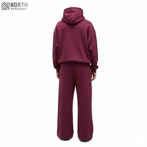 Conjuntos personalizados de ropa de calle de 2 piezas para hombre, sudaderas con capucha bordadas de nuevo diseño y pantalones acampanados, aspecto desteñido al sol lavado con ácido Vintage para invierno - Product Image 2