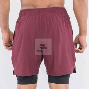 Pantalones cortos deportivos de doble capa con logotipo personalizado unisex con patrón sólido de cintura elástica y decoración informal de encaje - Product Image 4