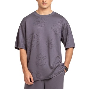 เสื้อยืดแฟชั่นคุณภาพสูง พิมพ์ลายโลโก้ตามสั่ง ผ้าฝ้าย 100% สวมใส่สบายๆ สำหรับกิจกรรมกลางแจ้ง ทรงหลวมไหล่ตก ระบายอากาศได้ดี - Product Image 1