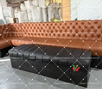 Canapé de banquette double face en cuir noir capitonné pour café
