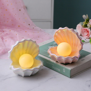 Joli plateau de rangement en céramique en forme de coquille avec <span class=keywords><strong>veilleuse</strong></span> LED <span class=keywords><strong>à</strong></span> piles pour la décoration intérieure, la chambre d'enfant, la présentation de bijoux et la décoration d'aquarium - Product Image 1