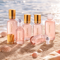 Flacon roll-on en verre rose 30 ml : Flacon roll-on élégant de luxe pour huiles essentielles et parfums, vente en gros sous marque privée