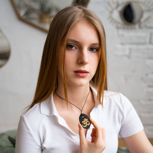 Colgante ovalado pulido de Shungita con impresión serigráfica Om 1.3*2 pulgadas (34*50 mm) - Product Image 3