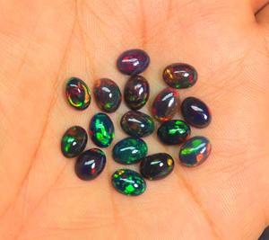 พลอยโอปอลทรงหลังเบี้ยสีดำทรงวงรีสีดำที่น่าสนใจสำหรับทำเครื่องประดับโอปอลเอธิโอเปียอัญมณีสีดำขัดเรียบขนาด8x6mm - Product Image 3