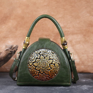 Forest <b>green</b> dome <b>bag</b> with a stunning embossed rose medallion and bamboo trim. Available at wholesale prices. - Product Image 1