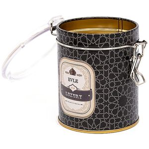 Boîte de rangement ronde en métal 90x110mm avec fermoir en fil métallique et couvercle transparent à motif de boule géométrique en or recyclable fond noir - Product Image 1