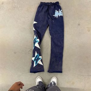 กางเกงวอร์มผ้าฟลีซสำหรับผู้ชายโอเวอร์ไซส์ผ้าฟลีซสำหรับผ้าพัฟพิมพ์ลายผ้าฝ้าย - Product Image 4