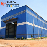 Entrepôt préfabriqué en structure métallique haute résistance, bâtiment métallique écologique pour la logistique et le stockage de marchandises en vrac