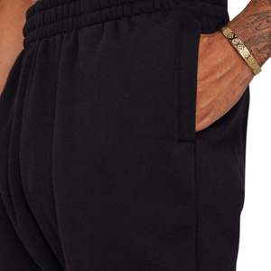 Pantalones de chándal colectivos negros para hombre, ajuste relajado, forro polar de algodón suave, cintura elástica, uso diario acogedor, detalle de logotipo Premium - Product Image 5