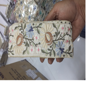 Cintas bordadas a máquina en varios diseños para vestidos de boda, cintas y encajes hechos a medida en tela base de crema y colores pastel - Product Image 1