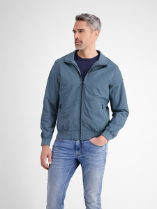 Venta al por mayor ligero impermeable a prueba de viento sin cuello chaqueta cortavientos personalizado estilo Formal logotipo frontal recubierto de procesamiento 100% - Product Image 4