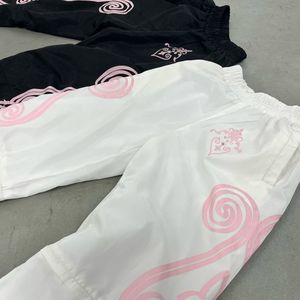 Pantalon de survêtement Fabrication personnalisée de haute qualité Flare Zip Flamme Broderie Coupe-vent Pantalon de survêtement pour hommes Pantalon en nylon - Product Image 3