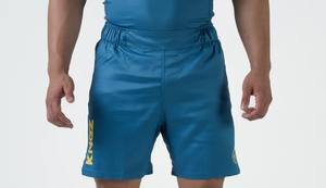 กางเกงขาสั้นมวยไทย MMA สำหรับผู้ชายเนื้อผ้าโพลีเอสเตอร์ระบายอากาศได้ดีแห้งเร็วป้องกันรังสียูวีของ100% - Product Image 6