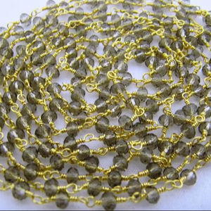 โซ่ร้อยสายลูกปัดขนาด3มม. มีเกล็ดหินควอทซ์สีควันขนาด3มม. - Product Image 1