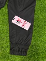 Pantalones de esquí cargo holgados unisex de alta calidad OEM, transpirables, ligeros, impermeables, 100% poliéster, de pierna ancha y extragrandes.
