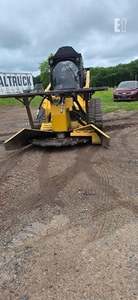 Chargeuse sur pneus CAT 299D avec attache broyeur, modèle à chenilles jaunes - Product Image 2
