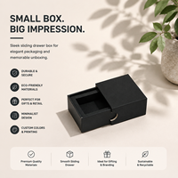 Boîte à bijoux en carton rigide gris cylindrique de luxe personnalisée avec ruban de finition mate et fermeture magnétique
