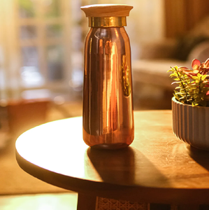 A sleek, polished copper water bottle with a modern design and a <b>secure</b> screw-top lid. - Product Image 2