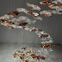 Lustre moderne d'intérieur personnalisé à LED en verre soufflé à la main Lustre design en forme de spirale pour les décorations de salon d'escalier de villa