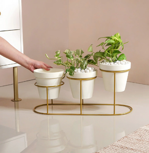 Minimalist Duo: Set of two tall white ceramic-look planters on sleek black metal <b>stands</b> The perfect modern accent for any corner - Product Image 4