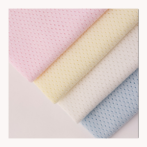 Alta calidad 100% algodón 32S tejido Jacquard agujero sólido Jersey tela transpirable estilo liso para ropa de bebé tela de punto - Product Image 1