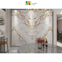 Dalle de pierre frittée dorée Calacatta aspect marbre de luxe Carreau mural au design moderne pour comptoirs de cuisine