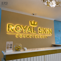 Enseigne murale lumineuse LED 3D personnalisée en métal doré rétroéclairé EZD pour la publicité des salons de beauté, spas, studios et devantures de magasins