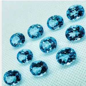 Topaze naturelle coupe ovale prix d'usine en gros haute qualité à facettes en vrac 12x14mm pierre précieuse bleu ciel par carat IGI - Product Image 1