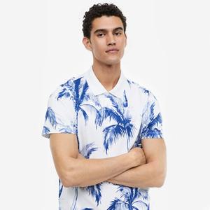 เสื้อโปโลสำหรับผู้ชายแบบลำลองเสื้อโปโลผ้าฝ้าย100% แขนสั้นระบายอากาศพิมพ์ลายเขตร้อน - Product Image 2