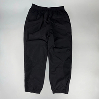 Chaqueta y pantalones de chándal de nailon a prueba de viento impermeables reflectantes de gran tamaño con cremallera de poliéster personalizados Conjunto unisex de chándal de nailon