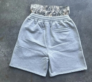 Pantalones cortos de secado rápido de nailon sólido con logotipo de abullonado personalizado, dobladillo crudo cortado, bolsillos con cremallera, ropa de calle, pantalones cortos de chándal para hombres - Product Image 1