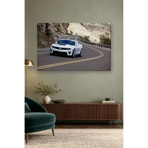 Impression sur toile : Fida White Camaro prenant une courbe de route en montagne - Product Image 1
